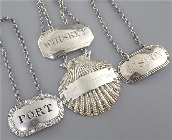 Three 19th century silver wine labels, Port, Lisbon & Whiskey, largest 50mm.